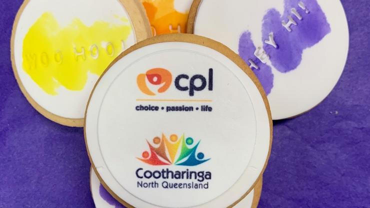 Cookies with the CPL and Cootharinga North Queensland logos on a purple background
