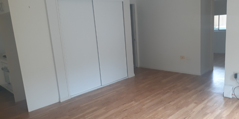 Photo of the bedroom. Shows an in-built wardrobe in addition to polished wood flooring. 