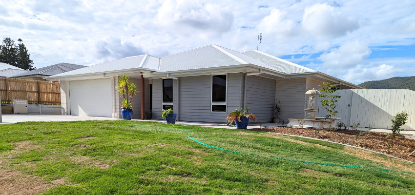 Front of Fuchsia Court property. Lovely maintained grass and front lawn is visible. 