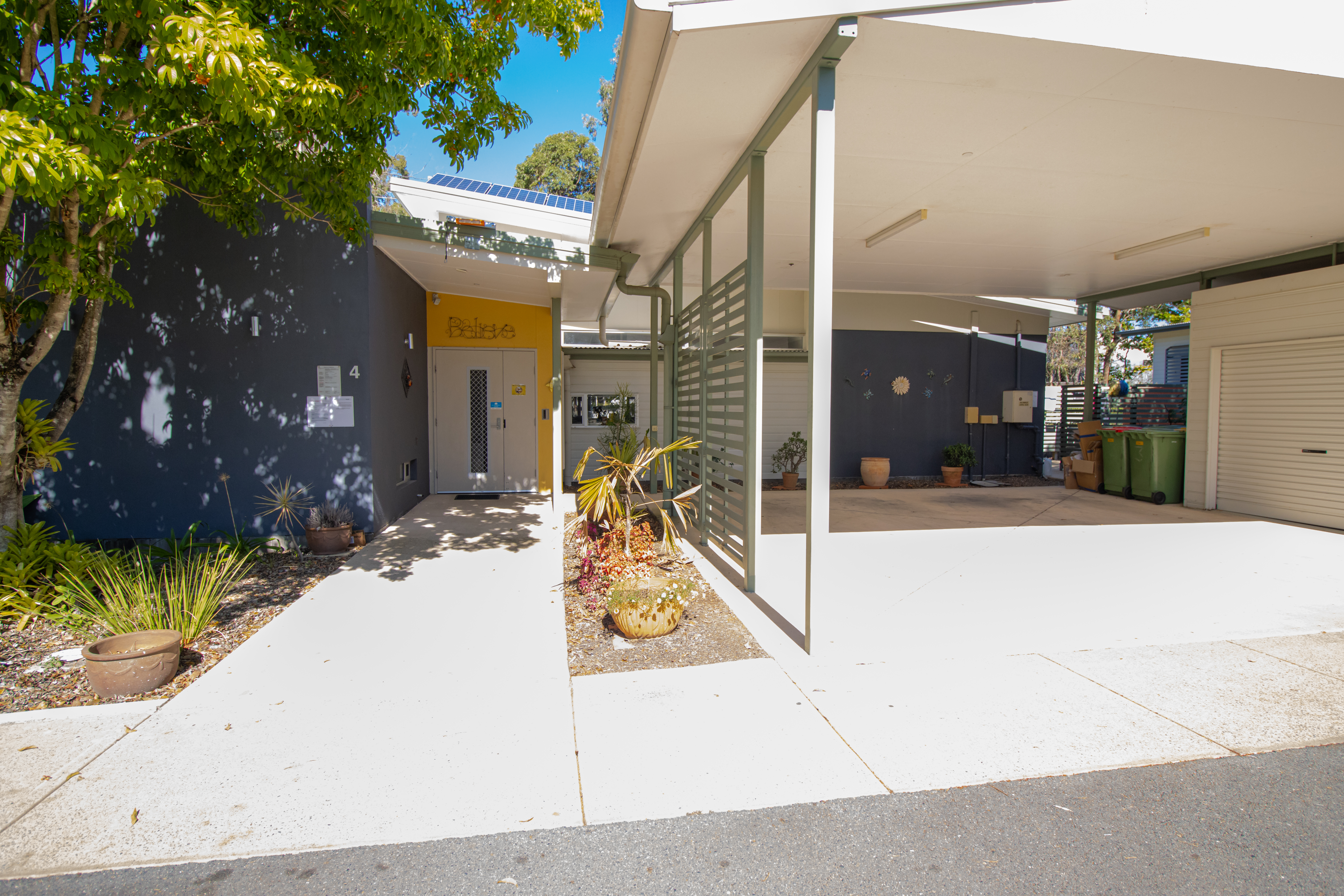 Front facade of a home with a carport