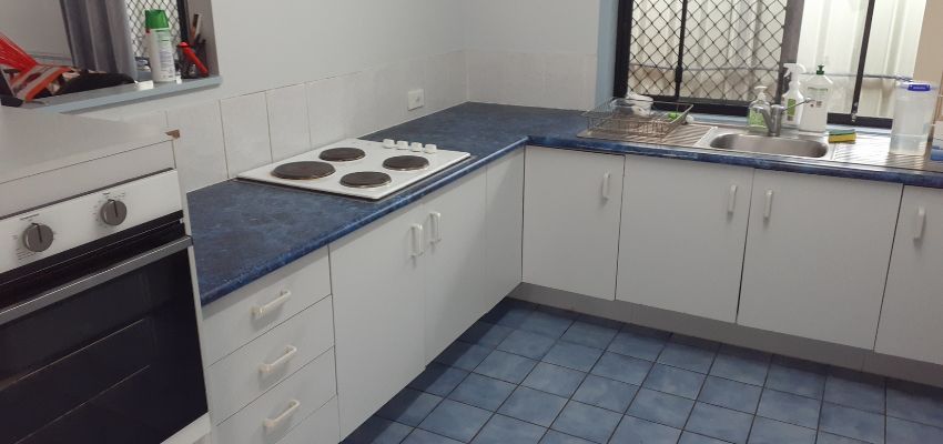 White kitchen with blue countertops