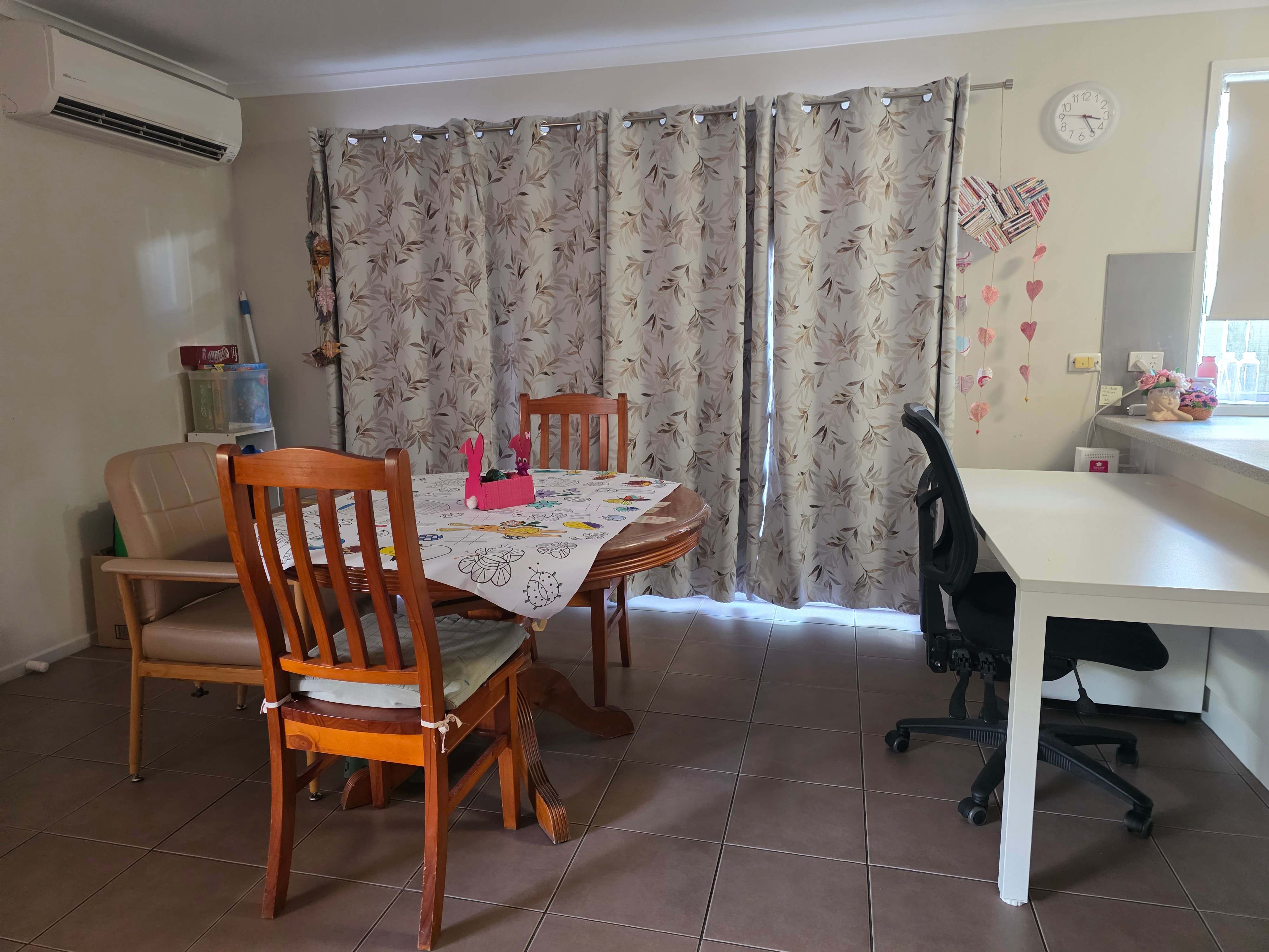An image showing the dining room with timber table and chairs