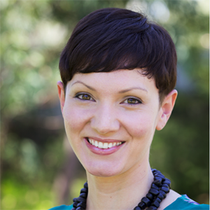 Headshot of Sophia Sambone. She has short dark hair and is wearing a thick beaded necklace and green blouse.