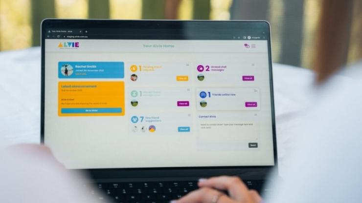 A laptop showing the Alvie website