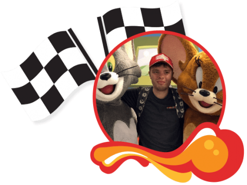 Levi_Movieworld_Donate Page A picture of Levi at Movieworld with Tom and Jerry character, inside a red circle with racing flags behind it