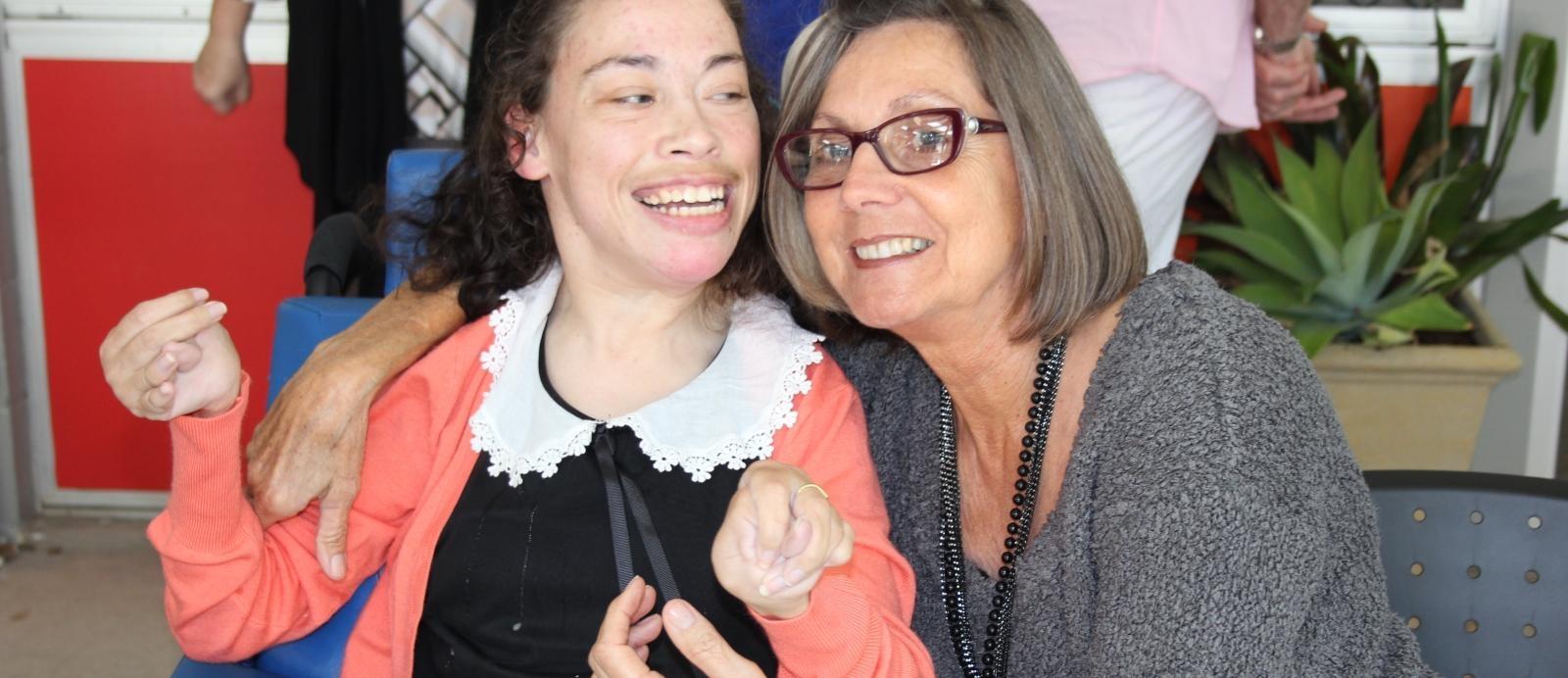 Mother and daughter, Larissa and Kathy smile having received NDIS support through CPL
