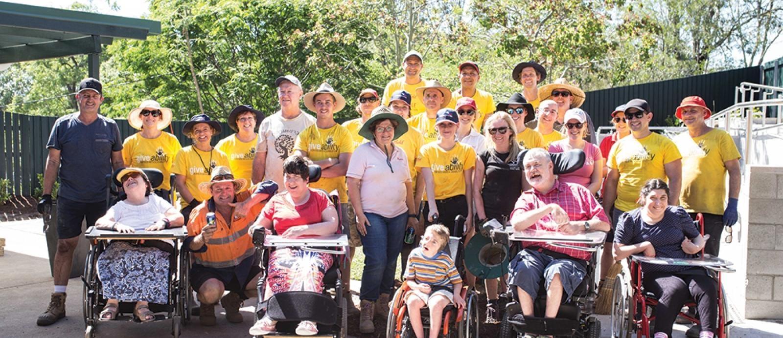 Corporate volunteers from telstra take a group photo at CPL capalaba