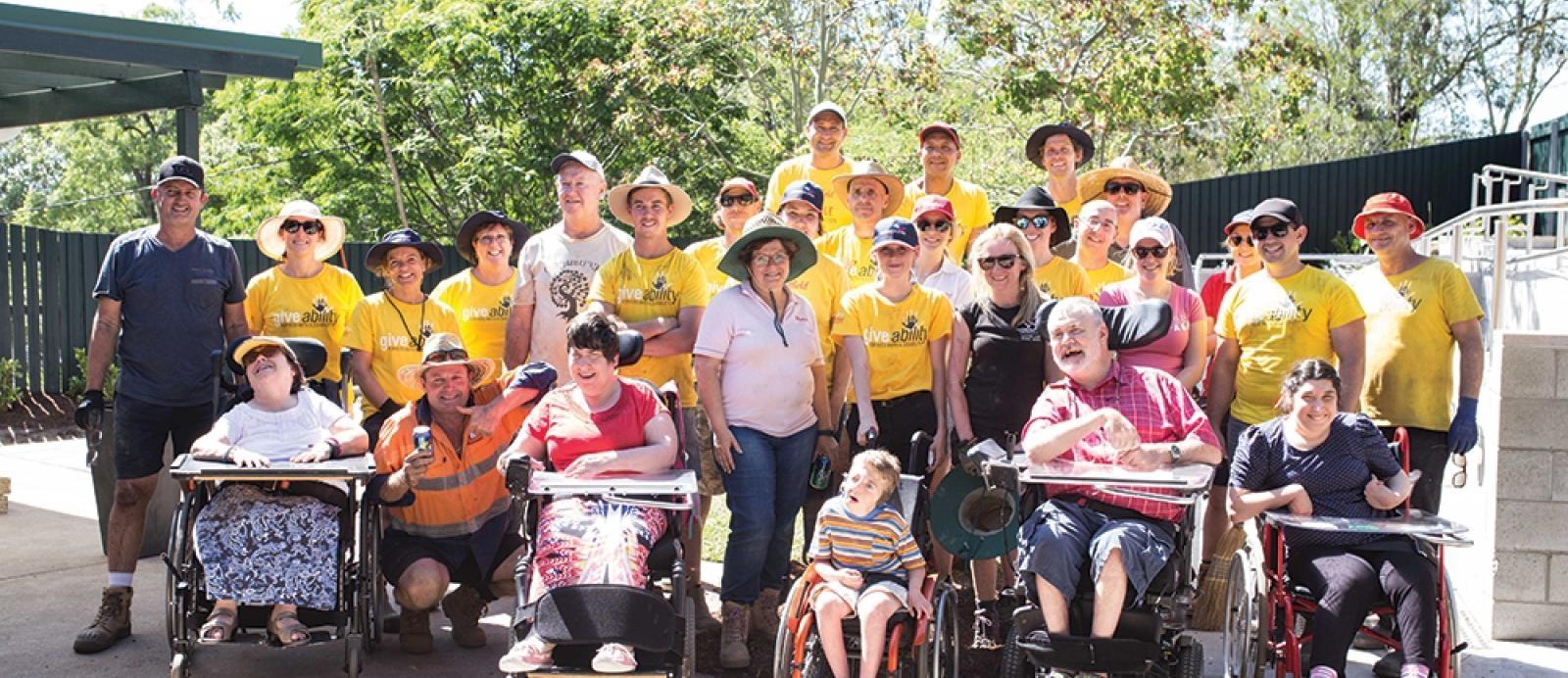 Corporate volunteers from telstra take a group photo at CPL capalaba 